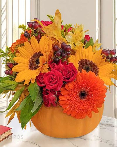 <p>Catch the essence of fall season with this beautiful flower bouquet. The Bloomin Pumpkin flower arrangement comes with Sunflower, Yellow Gerbera, Red Rose, and Hypericum berries and assorted greeneries in a pumpkin shaped flower vase. This orange-yellow bouquet will be the perfect addition to your Thanksgiving table or Halloween flower décor.</p>